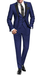 A man wears a royal blue three-piece suit with a black peak lapel and a polka dot tie.