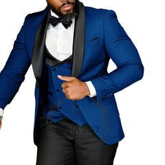 A man wears a slim-fit blue tuxedo jacket with a black shawl lapel, matching vest, and white shirt.