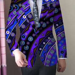 A man wears a skinny fit blazer featuring a vibrant blue and purple abstract floral print.