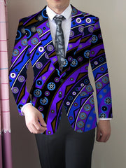 A man wears a skinny-fit blazer featuring a vibrant blue and purple abstract floral print.