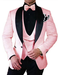 A three-piece pink floral patterned tuxedo suit with a black shawl lapel, vest, and bow tie.