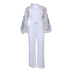 A white wide-leg jumpsuit featuring sheer lace long sleeves and a rhinestone-embellished belt.