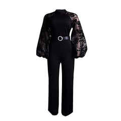 A black long-sleeve jumpsuit featuring sheer lace puff sleeves and a belted waist.