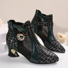 A pair of black mesh ankle boots featuring a pointed toe, block heel, and decorative jewel accent.