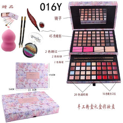 A Miss Rose makeup palette set featuring eyeshadows, blush, powder, concealer, and lip colors with included brushes and accessories.