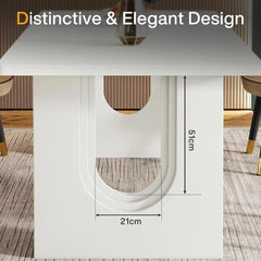 A large rectangular white dining table with a pedestal base that seats six to eight people.