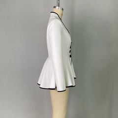 A white long-sleeved peplum jacket with black trim and a buttoned front on a mannequin.