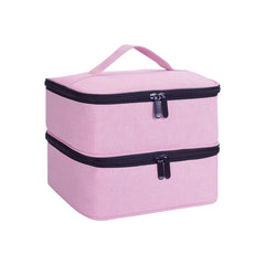 A pink, double-layered handheld cosmetic organizer bag with black zipper closures.
