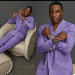A man wears a slim-fit, double-breasted purple suit consisting of a blazer and matching trousers.