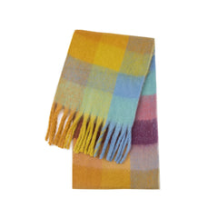 A long, thick, plaid-patterned scarf featuring a colorful mix of yellow, blue, and purple tones.