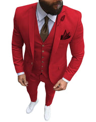 A man wears a slim-fit red three-piece suit with a white shirt, brown tie, and white sneakers.
