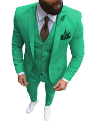 A man wears a bright green three-piece slim fit suit with a brown tie and white sneakers.