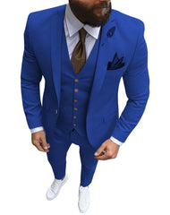 A man wears a slim-fit royal blue three-piece suit with a white shirt, brown tie, and white sneakers.