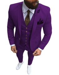 A man wears a slim-fit purple three-piece suit with a brown tie and white sneakers.