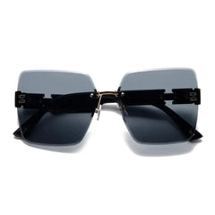 Rimless square sunglasses for women featuring black lenses and gold-tone metal accents.
