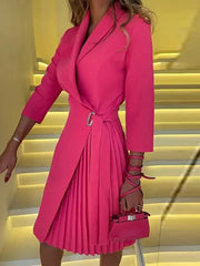 A knee-length, hot pink blazer dress with three-quarter sleeves, a V-neck, and a pleated skirt.