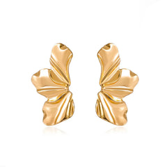 A pair of gold-toned stud earrings shaped like abstract, rippled flower petals.