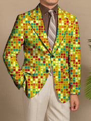 A man wears a slim-fit blazer featuring a vibrant geometric pattern in green, blue, and orange.