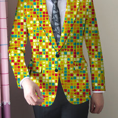 A man wears a slim-fit blazer featuring a vibrant geometric pattern in orange, green, and blue.