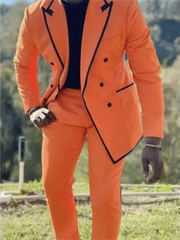 A man wears a bright orange double-breasted suit with black trim and a peaked lapel.
