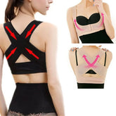 A woman wears a black and beige posture corrector brace with an X-shaped back design.
