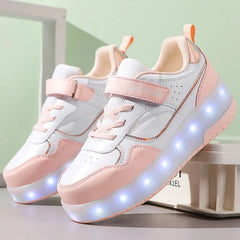 A pair of white and pink children's roller skate sneakers with glowing LED lights in the soles.