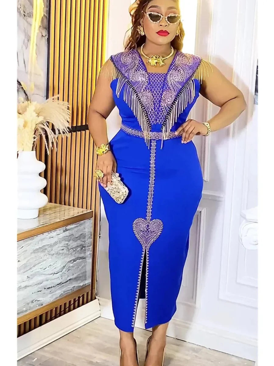 A woman wears a royal blue midi dress with gold fringe, beaded embellishments, and a heart detail.