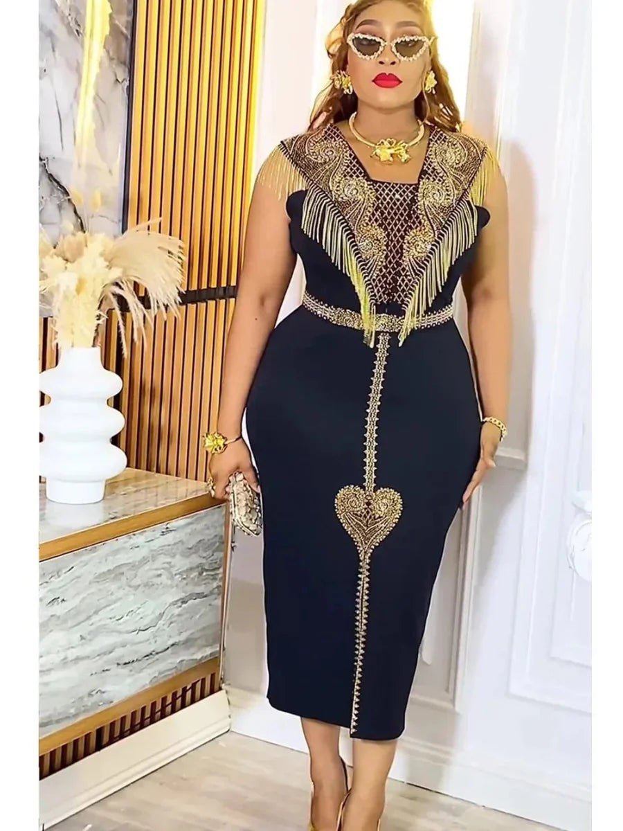 A woman wears a black midi dress with gold fringe, intricate embroidery, and a heart-shaped detail.