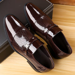 A pair of dark brown faux patent leather slip-on business shoes with a textured pattern.