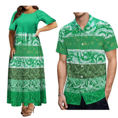 A woman wearing a green patterned maxi dress next to a man in a matching button-down shirt.