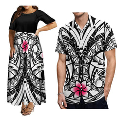 A woman wearing a black and white Polynesian print maxi dress next to a man in a matching shirt.