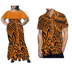A woman wearing an off-the-shoulder mermaid dress and a man wearing a matching short-sleeve shirt, both featuring an orange and black Polynesian print.