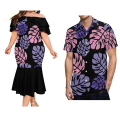 A woman in a black off-shoulder mermaid dress and a man in a matching tropical print shirt.