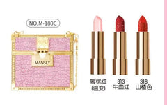 A pink glittery handbag case containing three lipsticks in varying shades of red and pink.
