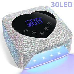 A heart-shaped, rhinestone-covered rechargeable UV LED nail lamp with a digital display.