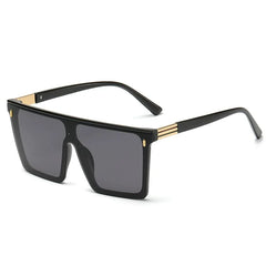 Oversized rectangular sunglasses with a one-piece black lens and gold-tone metal accents.