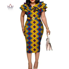 A woman wears a knee-length, short-sleeved African print dress with a ruffled collar and belt.