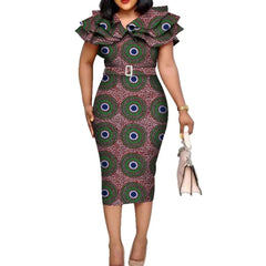 A woman wears a knee-length African print dress with a ruffled collar and a matching belt.