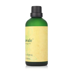 A 100ml bottle of Rinawale Camellia massage oil in a green glass container with a black cap.