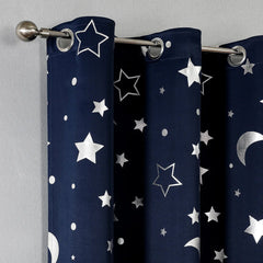 Navy blue blackout curtains featuring a silver star and moon print with metal grommets.