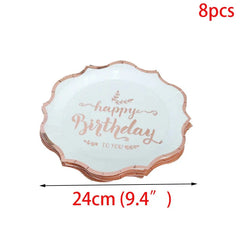 A stack of eight white paper plates with scalloped rose gold edges and Happy Birthday text.