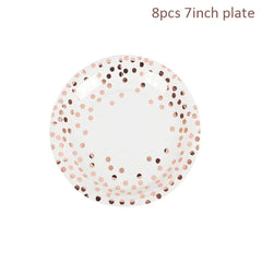 A white seven-inch disposable paper plate decorated with a rose gold polka dot pattern.