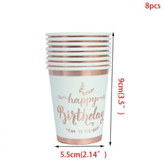 A stack of eight white paper cups featuring rose gold Happy Birthday text and trim.