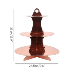 A three-tiered rose gold cardboard cupcake stand with dimensions of 33cm height and 24.5cm width.
