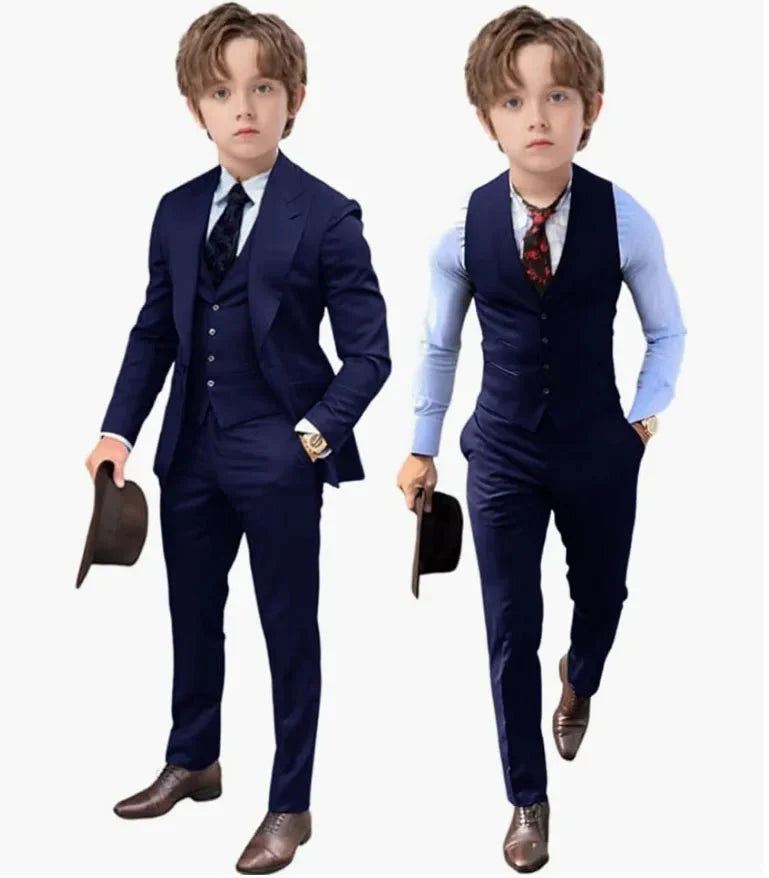 A young boy models a royal blue three-piece suit set including a jacket, vest, and trousers.