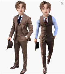 Two boys wearing brown three-piece suits with vests, dress shirts, and matching trousers.