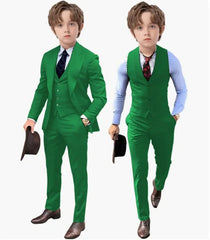 Two boys wearing matching green three-piece suits with a blazer, vest, and trousers.