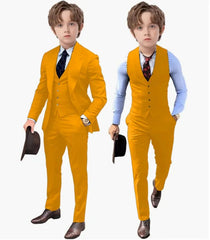 A young boy models a mustard yellow three-piece suit consisting of a jacket, vest, and trousers.
