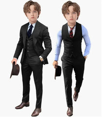 A young boy models a black three-piece suit set including a jacket, vest, and trousers.