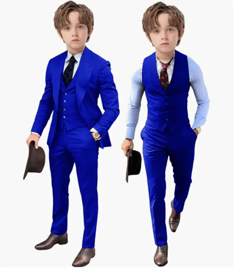 A young boy models a royal blue three-piece suit set including a jacket, vest, and trousers.